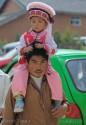 Man carrying child